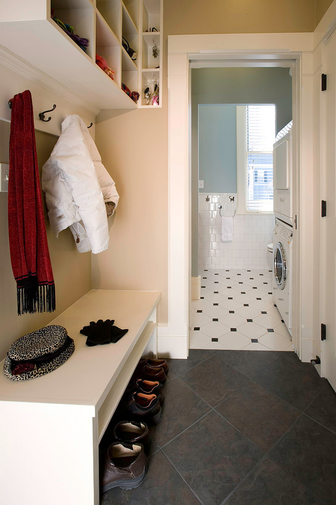 Inspiration for a small traditional mudroom in Boston with beige walls, slate floors and black floor.