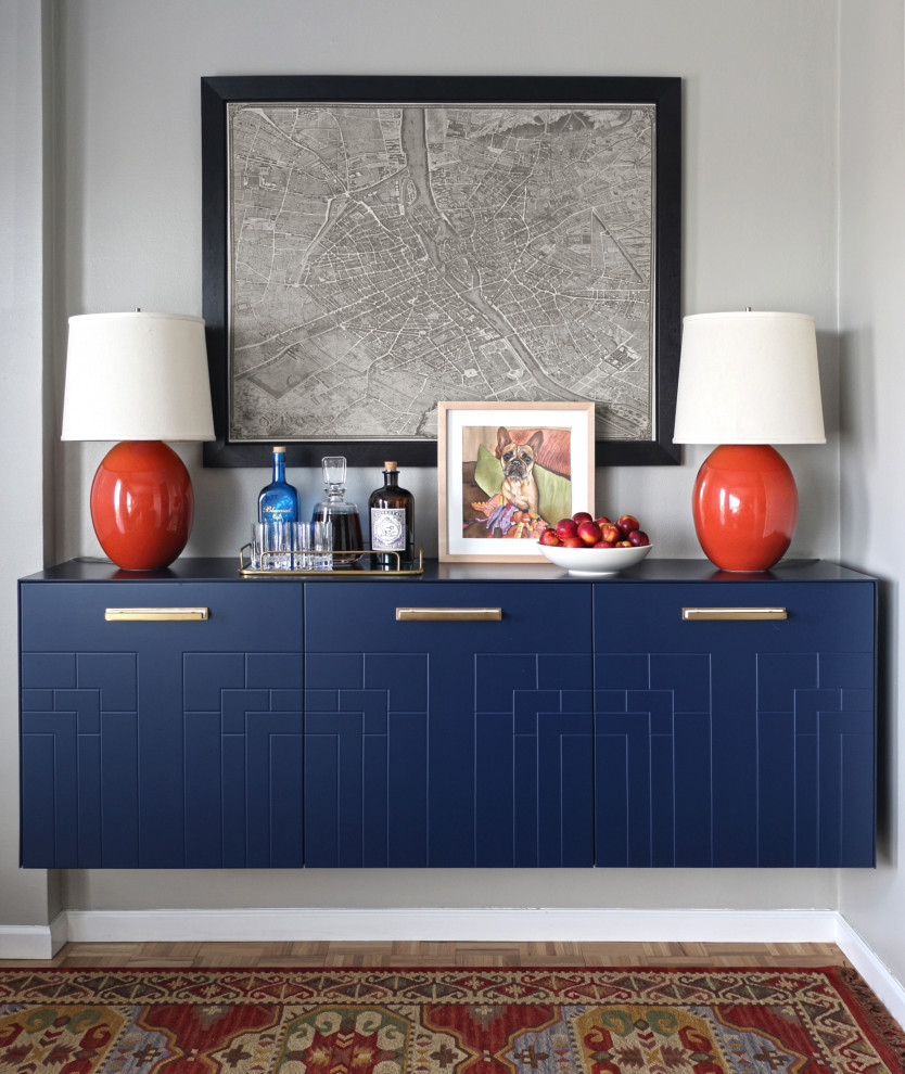 Inspiration for a small transitional galley home bar in New York with blue cabinets, wood benchtops, light hardwood floors and blue benchtop.