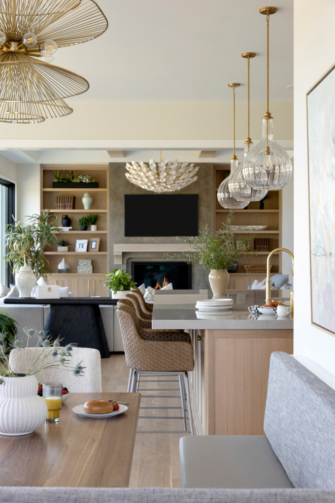 Living room - huge transitional open concept light wood floor living room idea in Minneapolis with beige walls, a standard fireplace and a wall-mounted tv