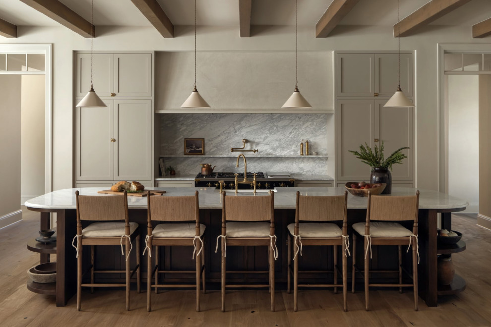 Transitional galley medium tone wood floor, brown floor and exposed beam kitchen photo in Austin with a farmhouse sink, shaker cabinets, gray cabinets, gray backsplash, stone slab backsplash, black appliances, an island and gray countertops