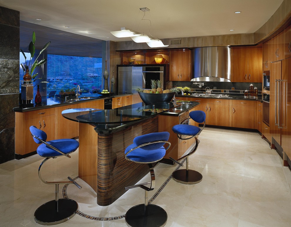 Photo of a large contemporary u-shaped separate kitchen in Phoenix with an undermount sink, flat-panel cabinets, medium wood cabinets, granite benchtops, black splashback, stone slab splashback, stainless steel appliances, travertine floors, with island, beige floor and black benchtop.