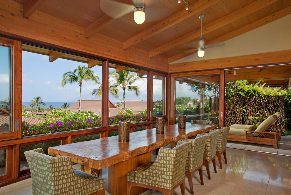 Inspiration for a tropical dining room remodel in Hawaii with beige walls