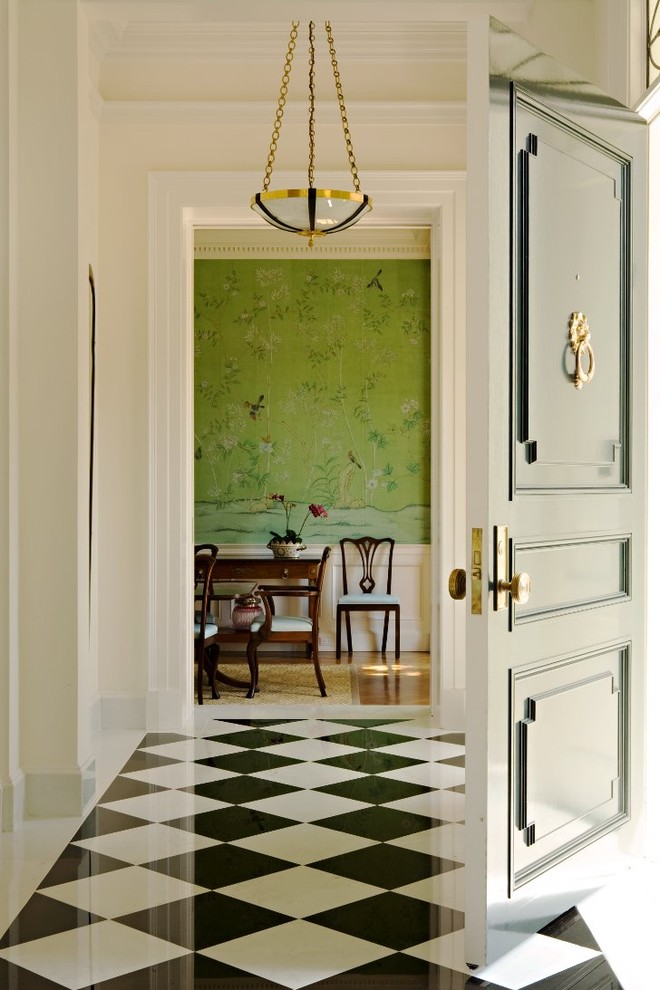 Design ideas for a traditional entryway in Los Angeles with beige walls, a single front door, marble floors and multi-coloured floor.