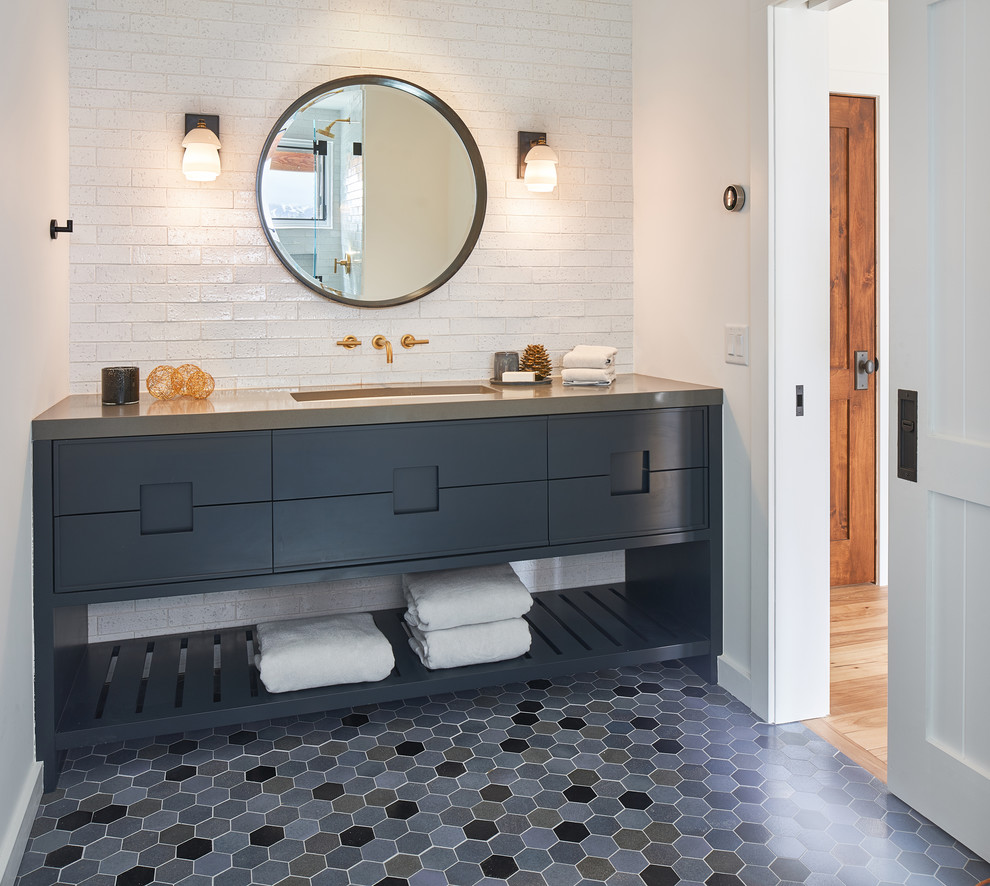 Photo of a transitional bathroom in Other with grey cabinets, white tile, white walls, mosaic tile floors, an undermount sink, grey floor, grey benchtops and flat-panel cabinets.