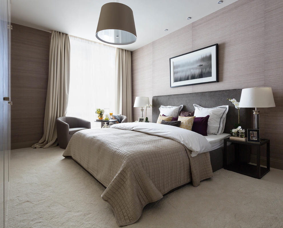 Classic master bedroom in Moscow with beige walls, carpet and beige floors.