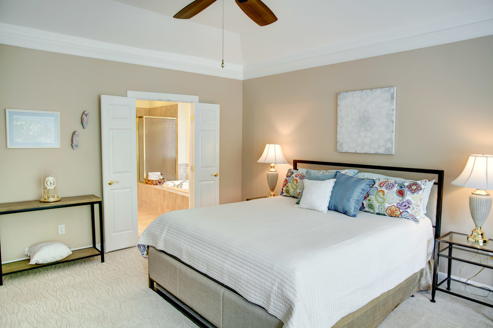 Photo of a mid-sized transitional master bedroom in Cincinnati with beige walls, carpet, beige floor and no fireplace.