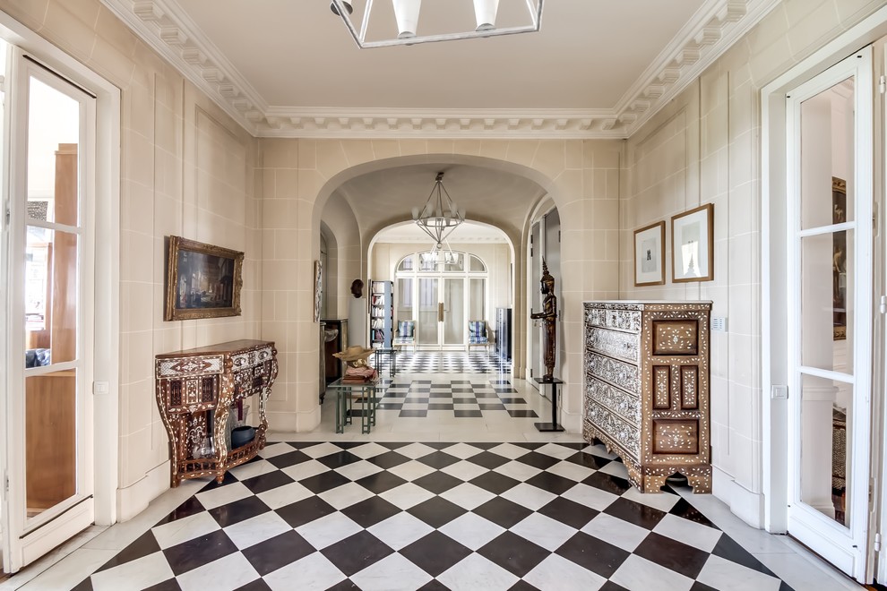 Inspiration for an expansive traditional hallway in Paris with beige walls.