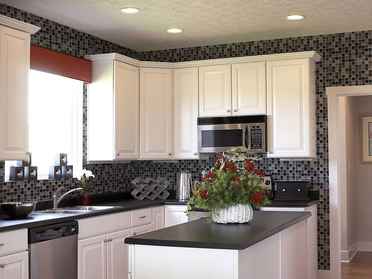 Photo of a mid-sized traditional separate kitchen in Sacramento with multi-coloured splashback, mosaic tile splashback, stainless steel appliances, medium hardwood floors and with island.