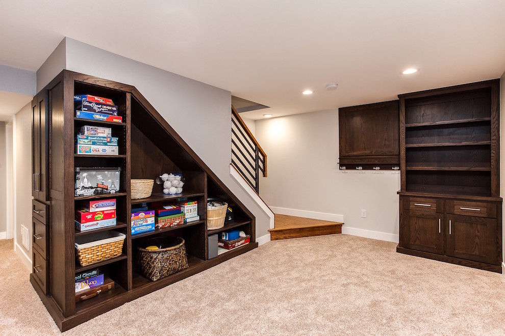 This is an example of a mid-sized contemporary fully buried basement in Denver with grey walls, carpet and no fireplace.