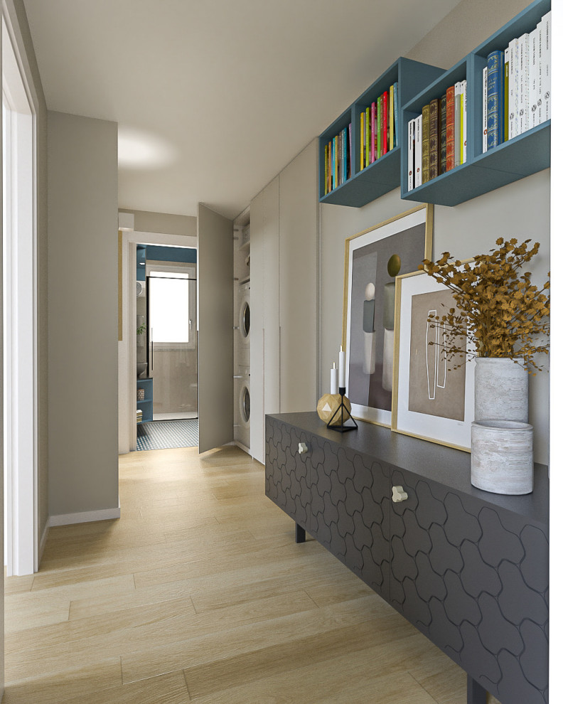 Inspiration for a mid-sized contemporary light wood floor and tray ceiling hallway remodel in Milan with beige walls