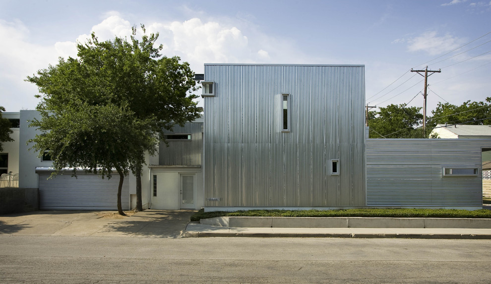 Design ideas for an industrial exterior in Dallas with metal siding.