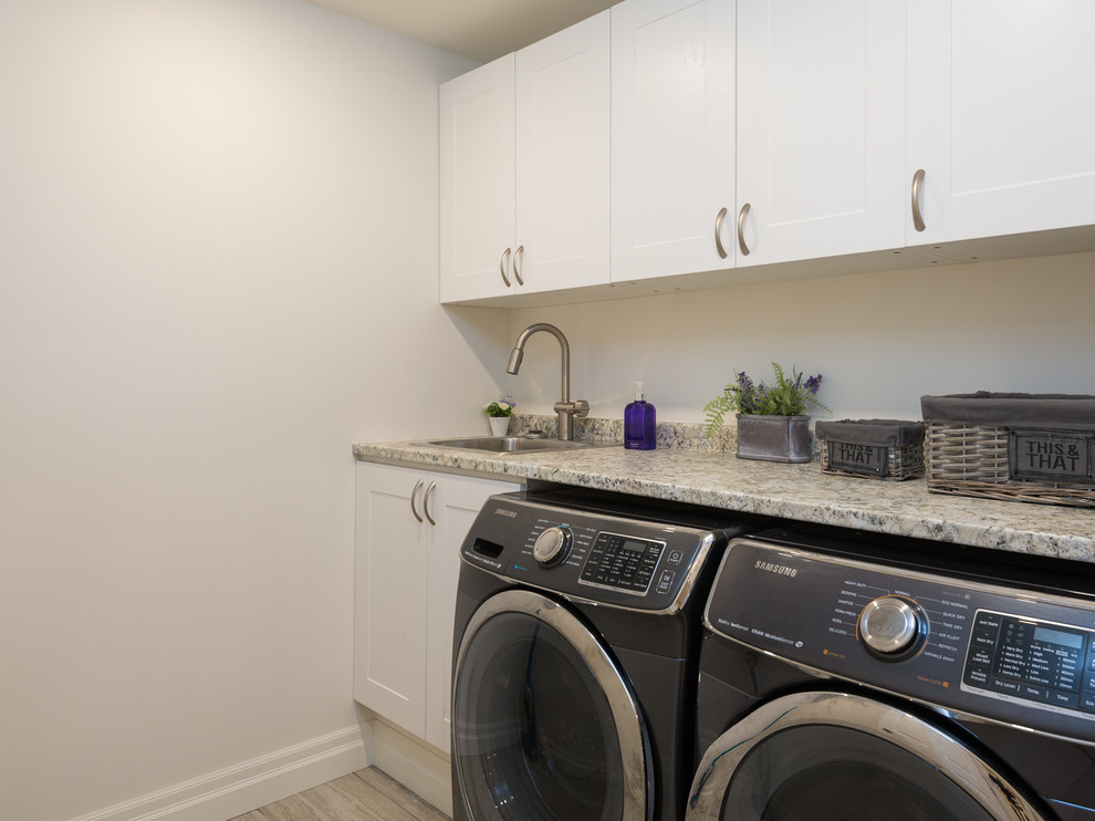 Inspiration for a mid-sized traditional laundry room in Vancouver.