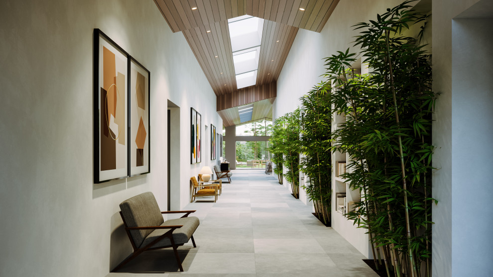 Inspiration pour un couloir design en bois de taille moyenne avec un mur blanc, sol en béton ciré, un sol gris et un plafond voûté.