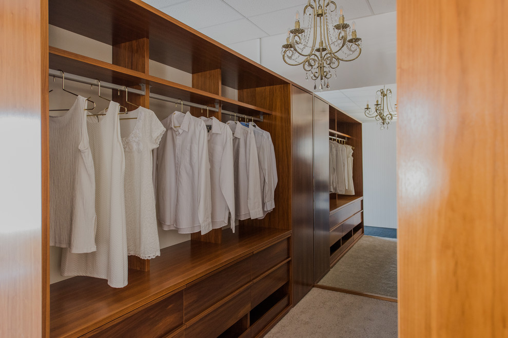 Design ideas for a large traditional gender-neutral walk-in wardrobe in Wellington.