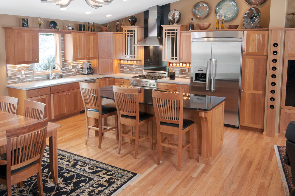 Example of an arts and crafts kitchen design with recessed-panel cabinets