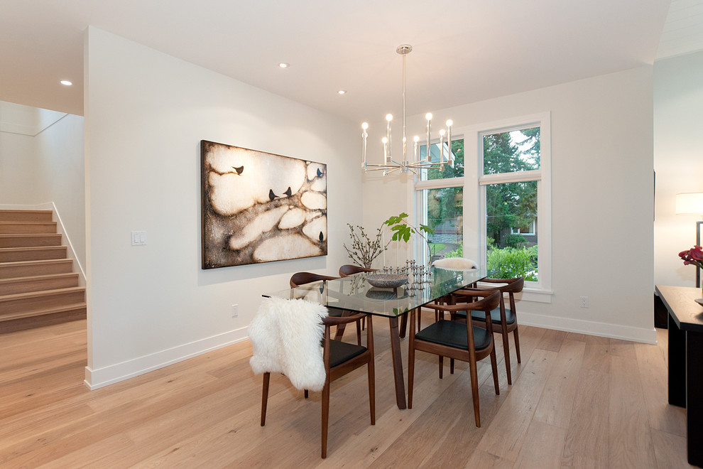 Inspiration for a contemporary dining room in Vancouver with white walls.
