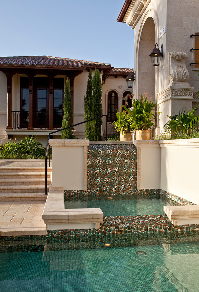 Design ideas for a mediterranean garden in Miami with a water feature.