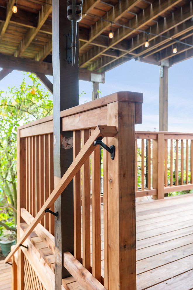 Large mountain style backyard second story wood railing deck photo in San Francisco with no cover