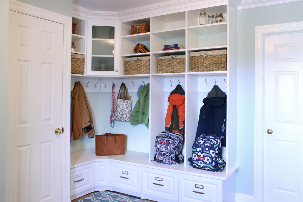 Inspiration for a small traditional mudroom in New York with blue walls and ceramic floors.