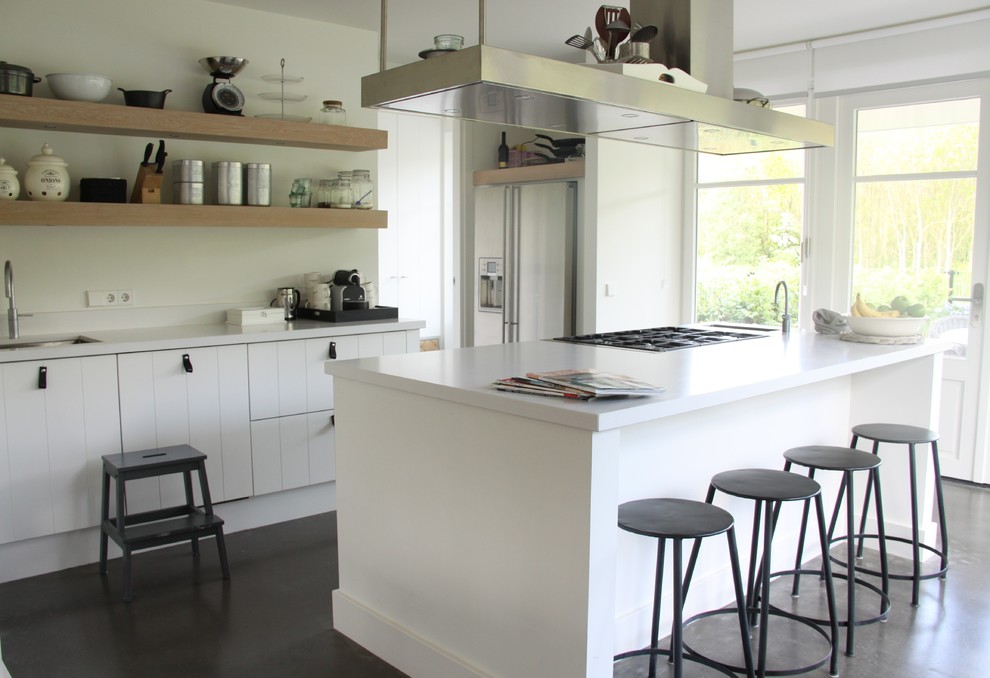 This is an example of a contemporary kitchen in Amsterdam with stainless steel appliances.