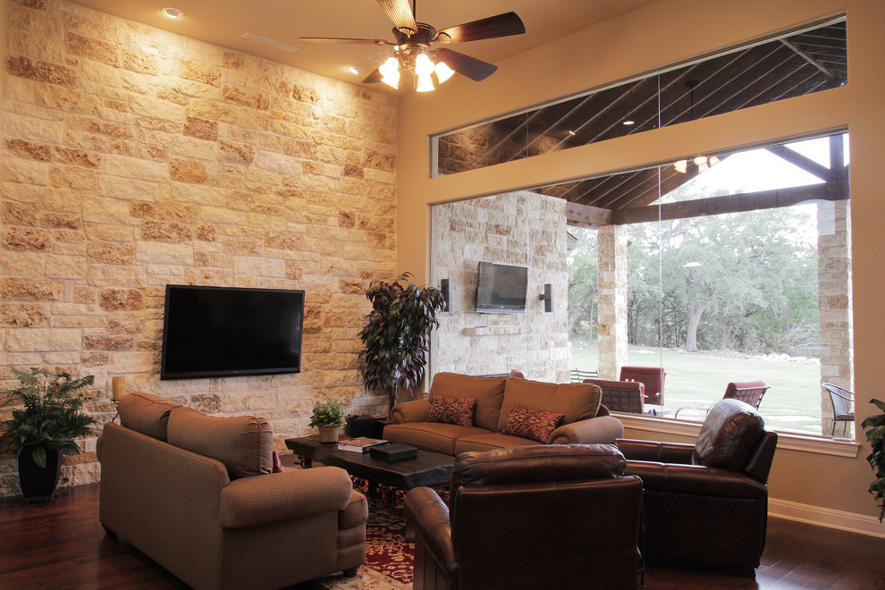 Inspiration for a mid-sized traditional formal open concept living room in Austin with beige walls, medium hardwood floors and a wall-mounted tv.