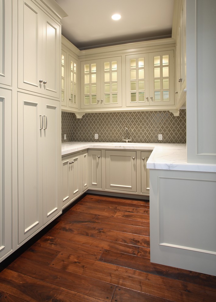 This is an example of a traditional kitchen in San Francisco with beaded inset cabinets and white cabinets.
