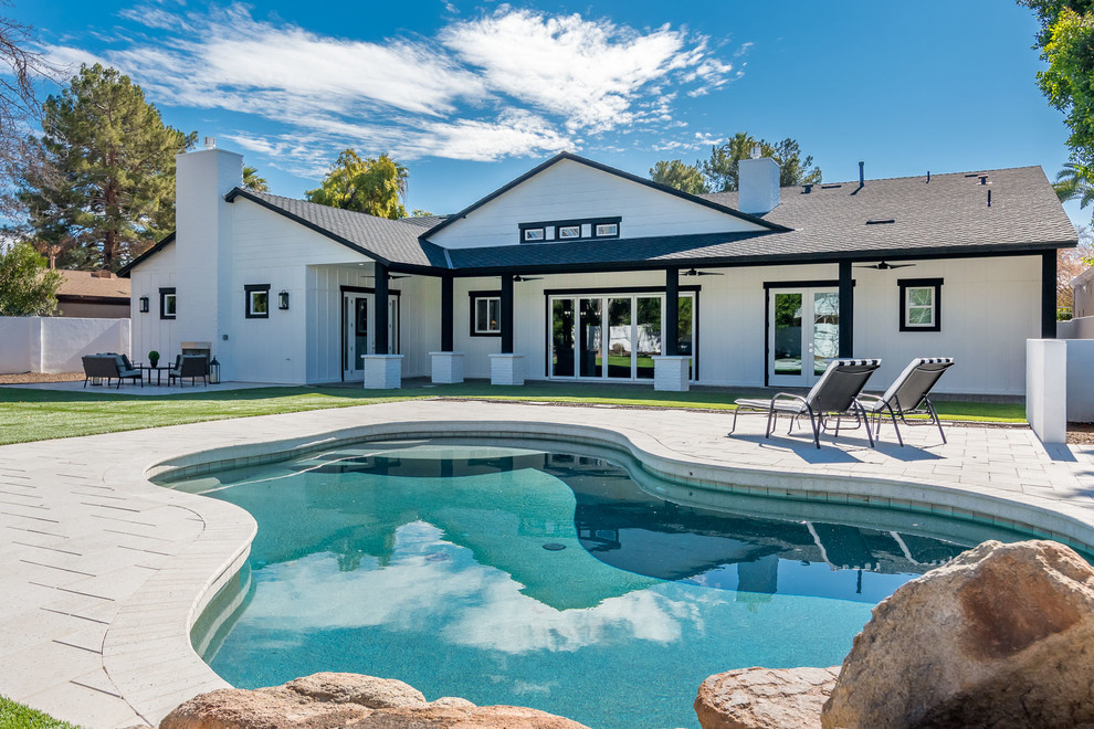 Inspiration for a transitional backyard custom-shaped pool remodel in Phoenix