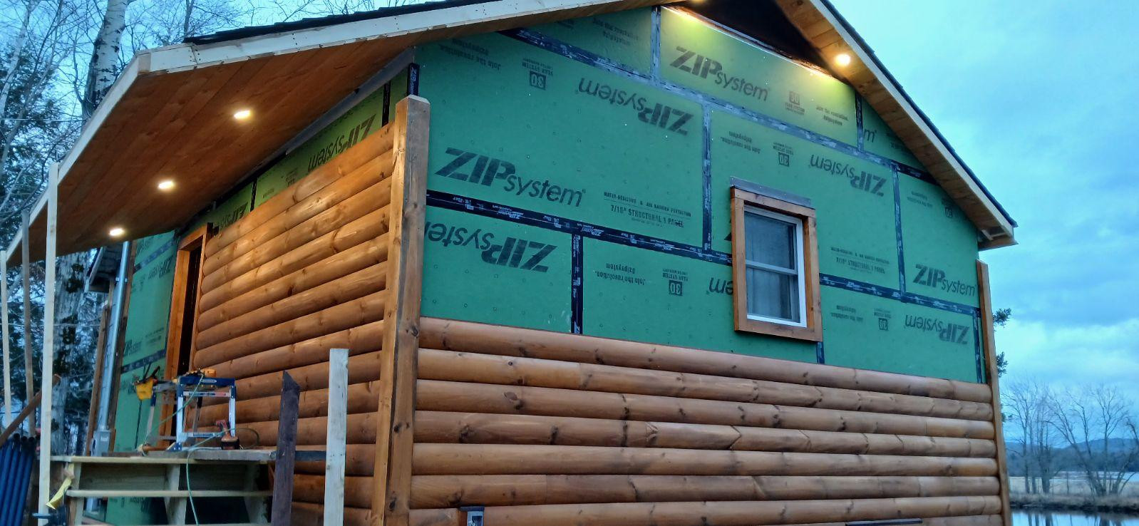 Log Siding, Stamped Concrete and Post and Beam Carport