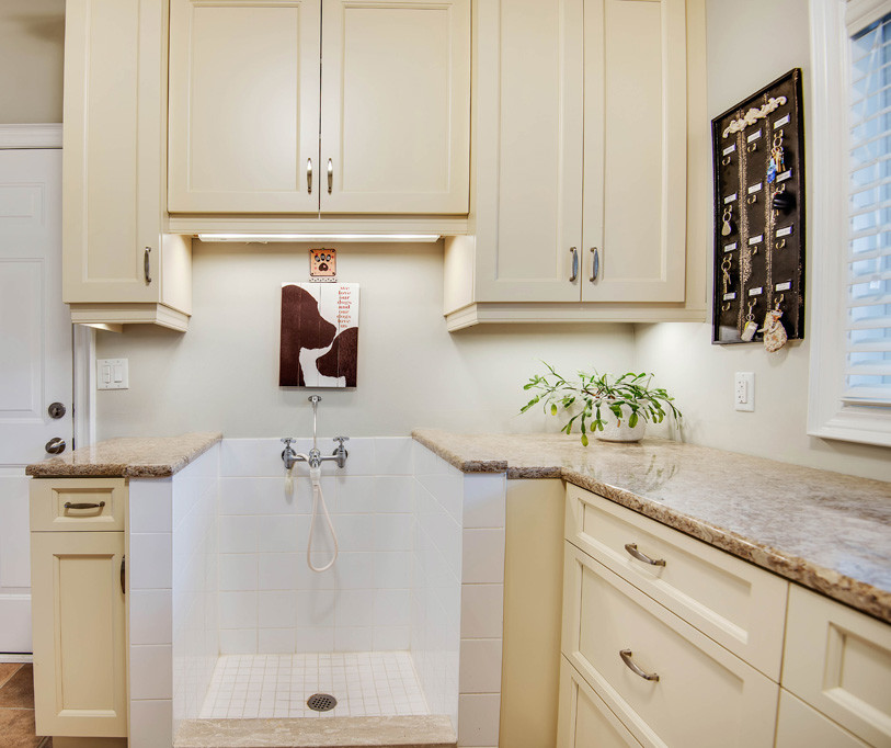 Inspiration for a large timeless l-shaped porcelain tile and beige floor utility room remodel in Toronto with an undermount sink, shaker cabinets, white cabinets, granite countertops, white walls, a side-by-side washer/dryer and beige countertops