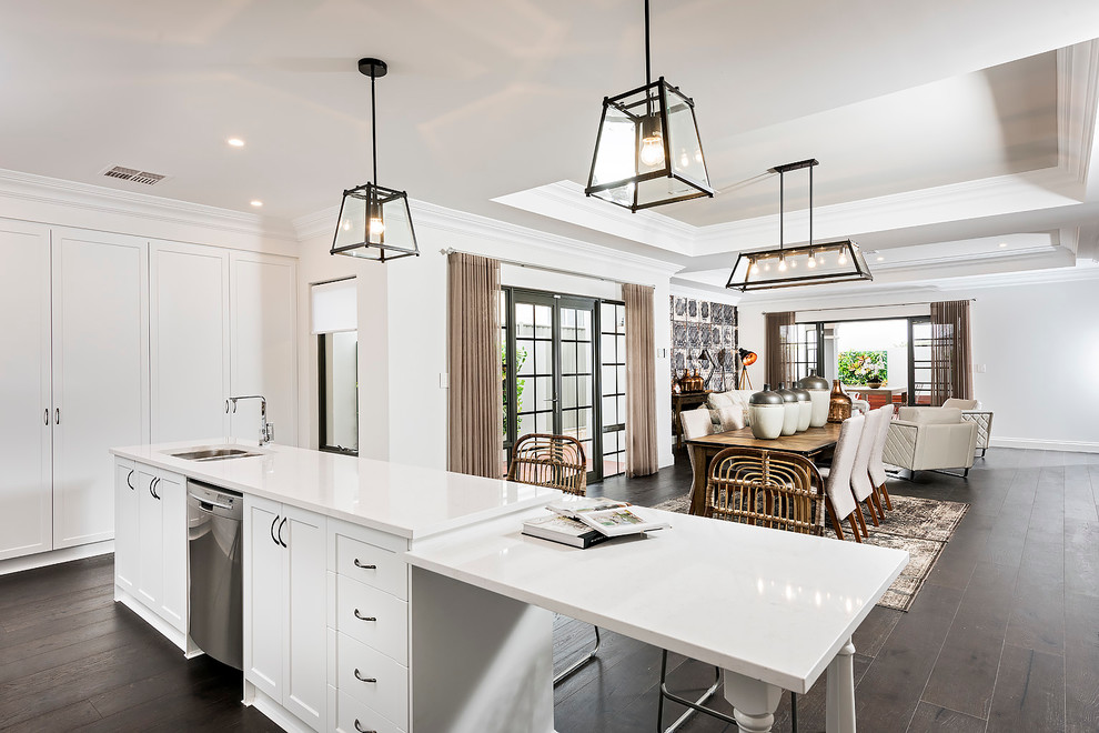 Photo of a contemporary kitchen/dining combo in Perth with white walls and dark hardwood floors.