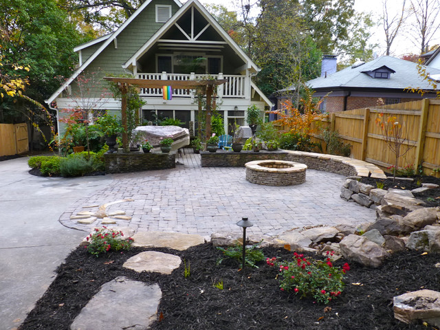 Backyard firepit with seating around traditional-patio
