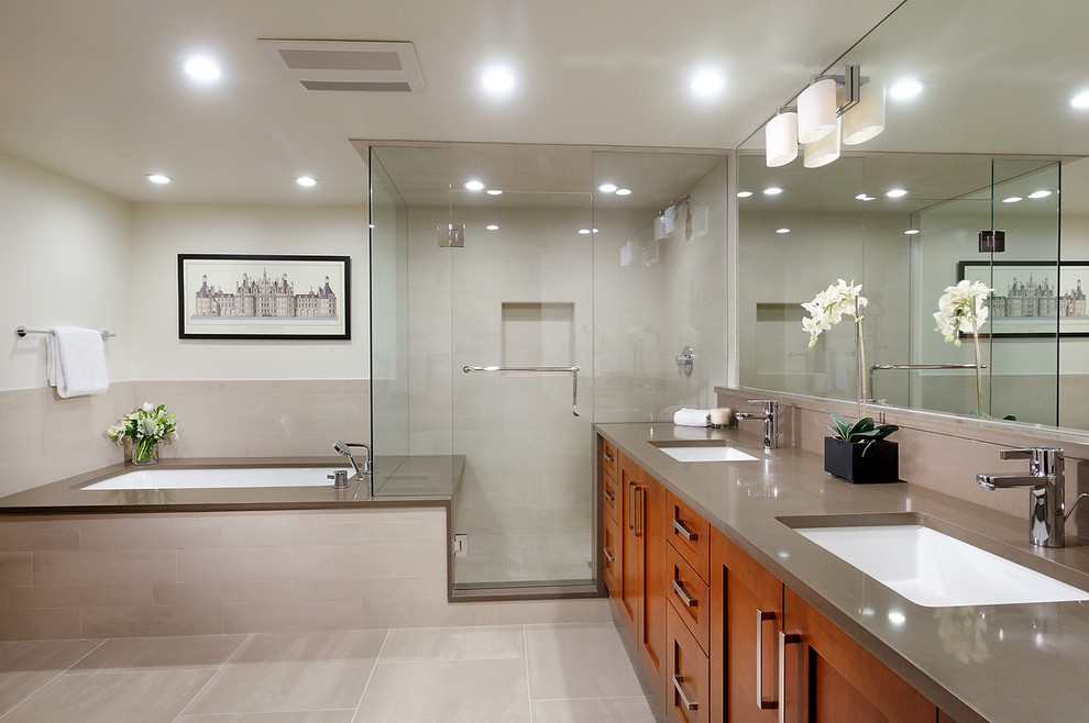 Inspiration for a contemporary bathroom in Denver with an undermount tub and grey benchtops.