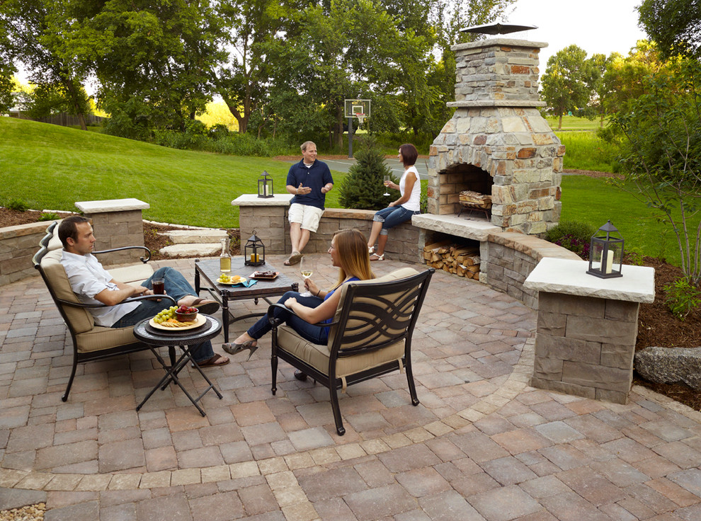 Inspiration for a small transitional backyard patio in Minneapolis with a fire feature, concrete pavers and no cover.