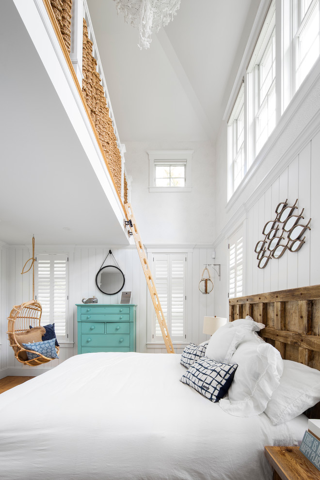 Inspiration for a beach style bedroom in Boston with white walls.