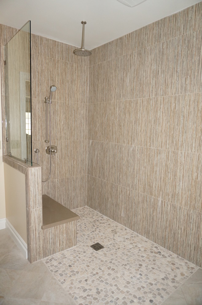 Photo of a mid-sized contemporary master bathroom in Santa Barbara with an open shower, pebble tile, ceramic floors, beige tile and beige walls.