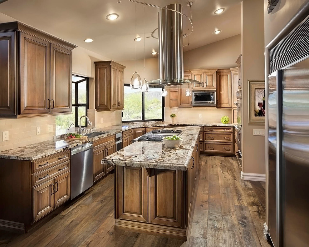 Medium tone wood floor kitchen photo in Phoenix with granite countertops, beige backsplash, stainless steel appliances and an island