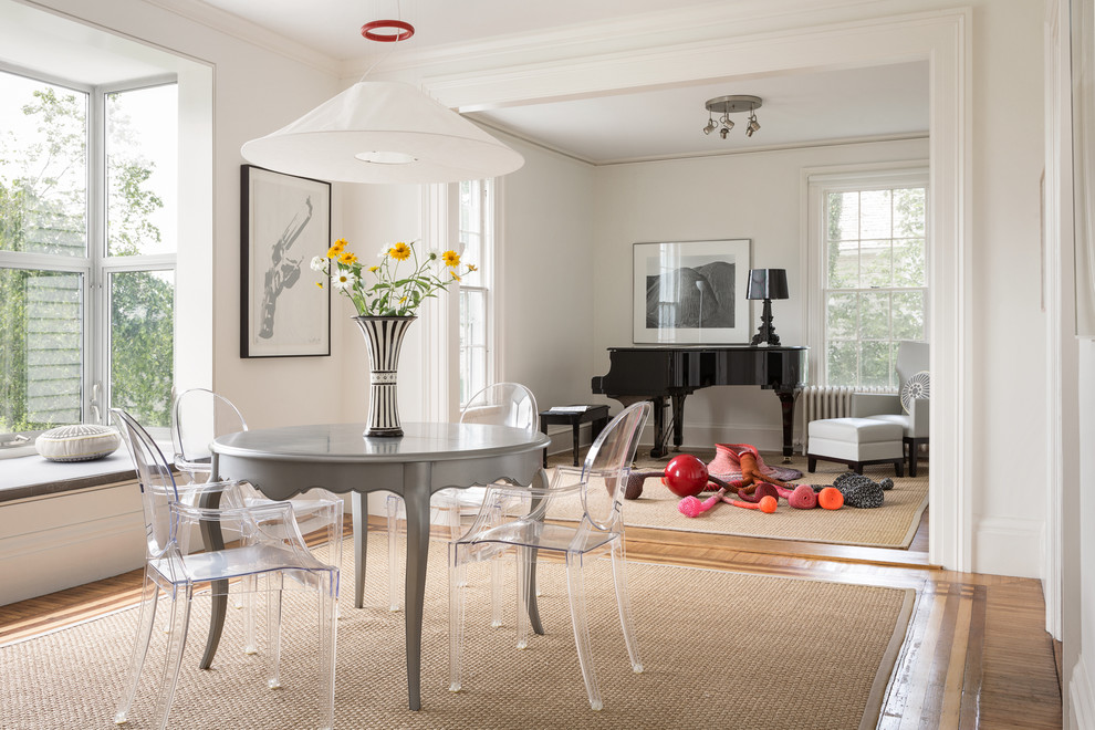 Inspiration for a transitional medium tone wood floor great room remodel with white walls
