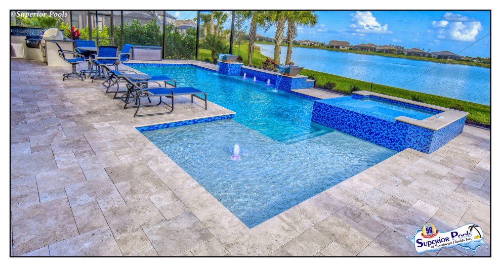 Design ideas for a large modern backyard rectangular lap pool in Tampa with a water feature and brick pavers.