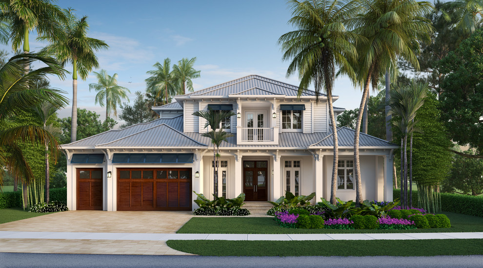 Inspiration for a large tropical two-storey white house exterior in Miami with concrete fiberboard siding, a gable roof and a metal roof.