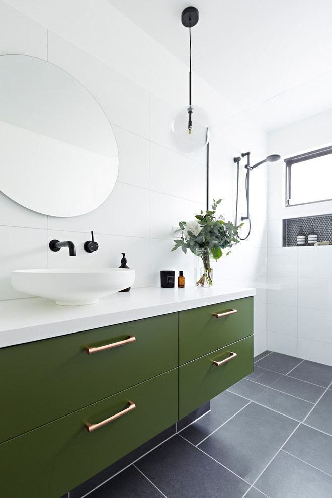 Inspiration for a mid-sized contemporary 3/4 bathroom in Melbourne with green cabinets, white tile, white walls, a vessel sink, grey floor, an open shower, white benchtops, an open shower, porcelain tile, engineered quartz benchtops and flat-panel cabinets.