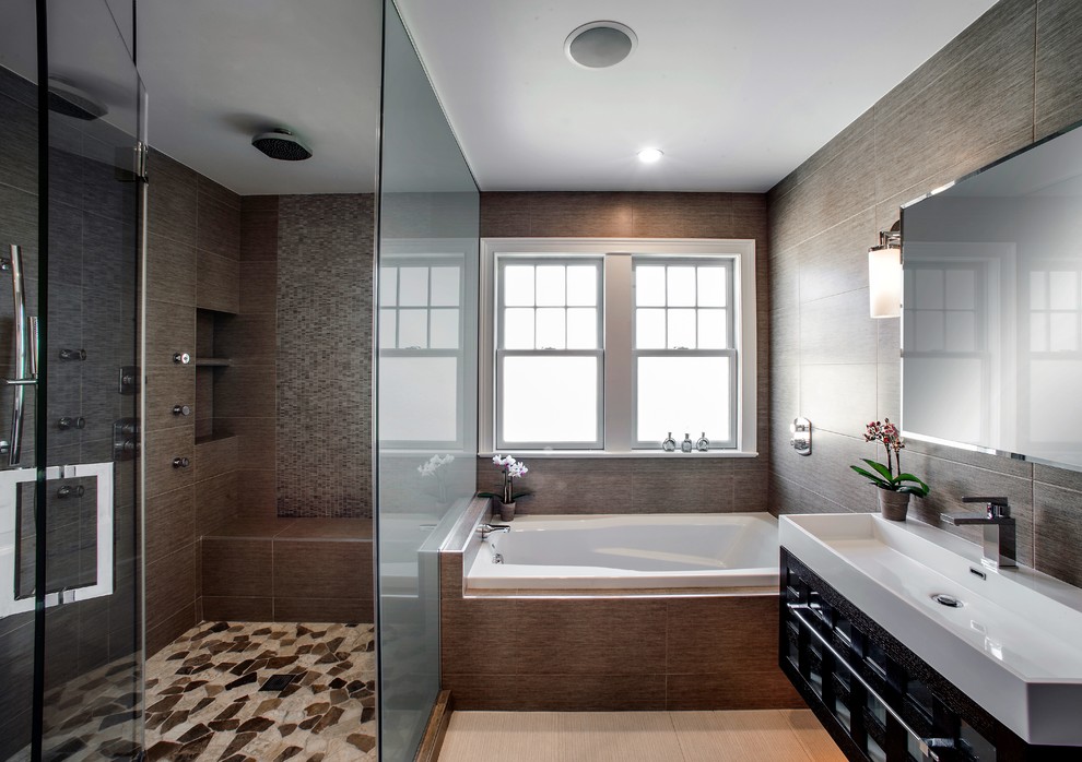 Photo of a mid-sized transitional master bathroom in New York with a hot tub, a shower/bathtub combo, brown tile, ceramic tile, brown walls and ceramic floors.