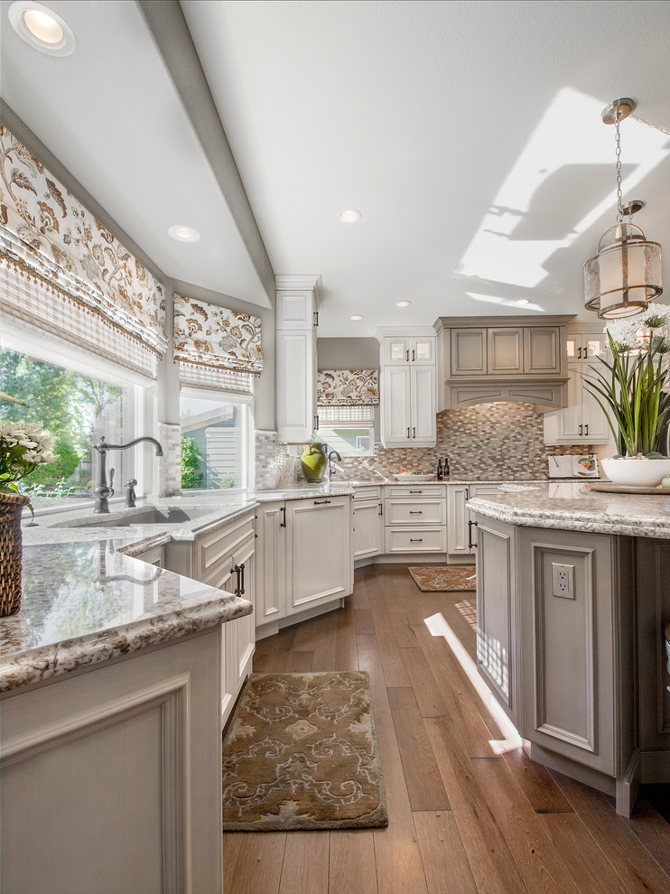 Example of a large transitional u-shaped dark wood floor eat-in kitchen design in Denver with beaded inset cabinets, distressed cabinets, granite countertops, metallic backsplash, metal backsplash, stainless steel appliances and an island