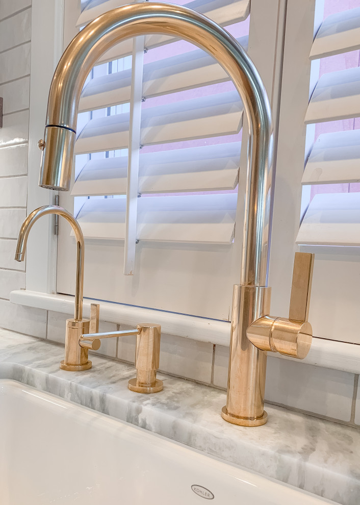 Example of a transitional kitchen design in Denver