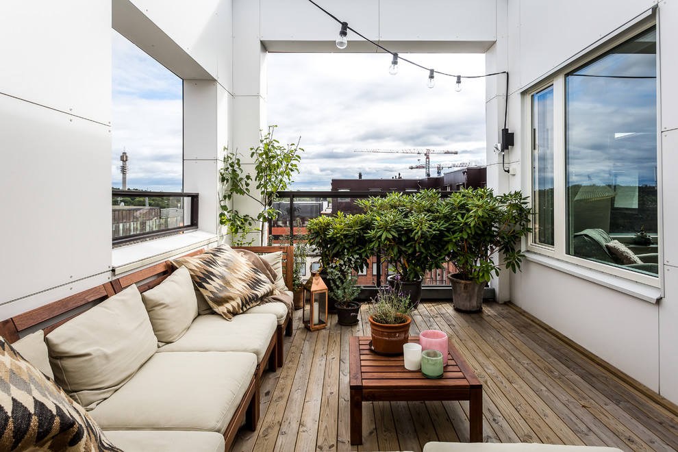 Inspiration for a large scandinavian deck in Stockholm with no cover.