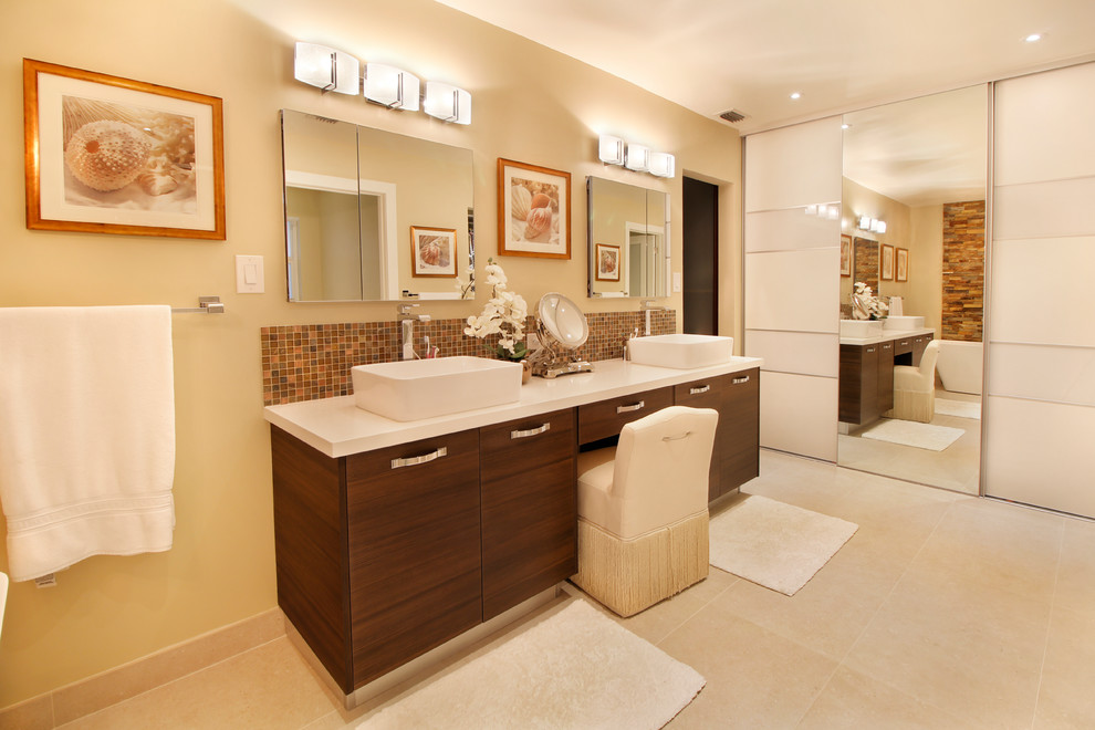 Large contemporary master bathroom in Miami with flat-panel cabinets, brown cabinets, a freestanding tub, an alcove shower, a one-piece toilet, beige tile, porcelain tile, beige walls, porcelain floors, an undermount sink, engineered quartz benchtops, beige floor and a hinged shower door.