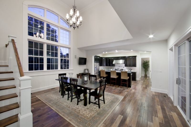Design ideas for a large contemporary kitchen/dining combo in Wilmington with white walls and medium hardwood floors.