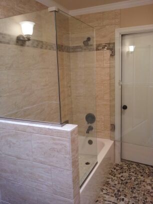 This is an example of a contemporary master bathroom in Seattle with an open shower, a one-piece toilet and cement tile.