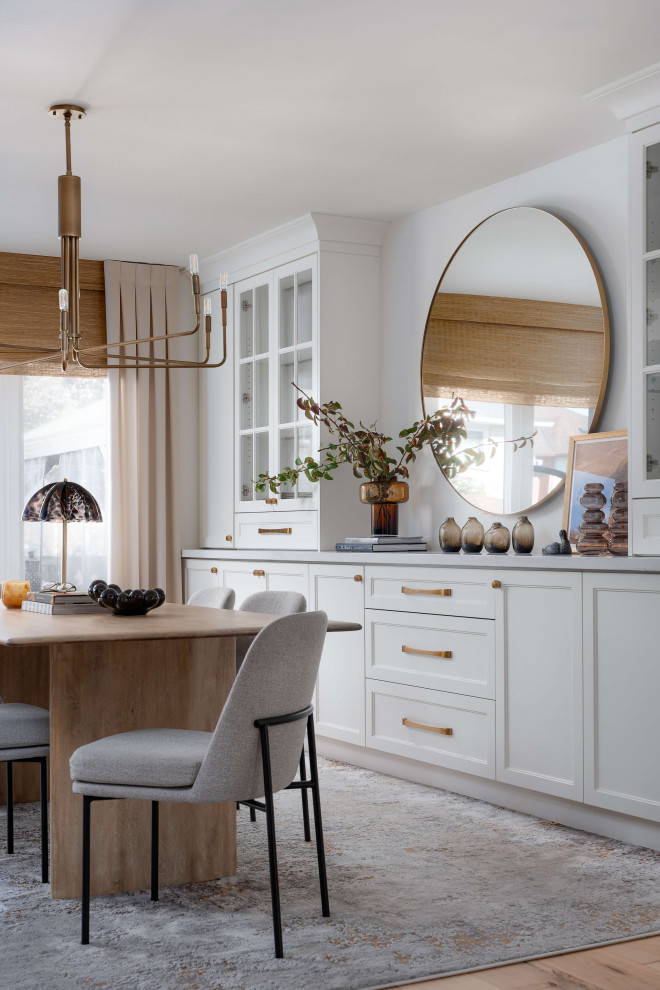Mid-sized transitional medium tone wood floor and beige floor kitchen/dining room combo photo in Toronto with white walls