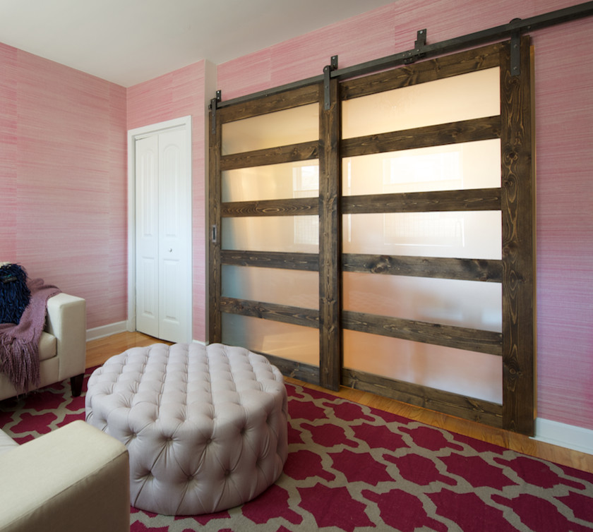 Inspiration for a small modern enclosed family room in DC Metro with pink walls, light hardwood floors, no fireplace and no tv.