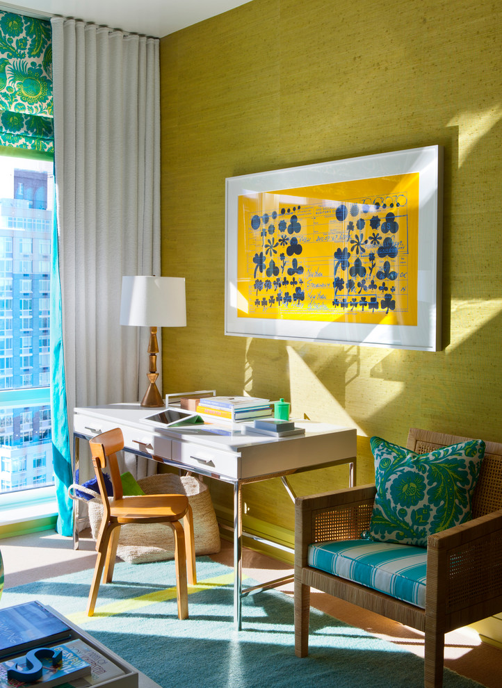 Eclectic home office in New York with green walls and a freestanding desk.